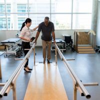 A stroke victim undergoes rehabilitation with a physical therapist. May is National Stroke Awareness Month in the U.S.
